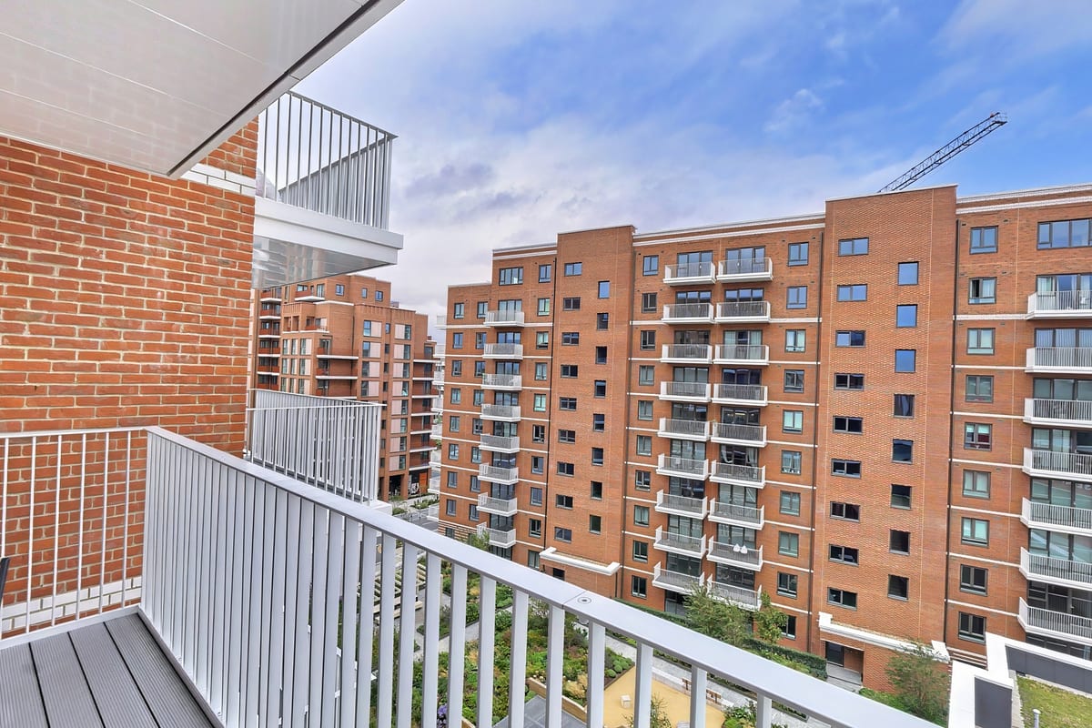 Seventh-floor balcony view across the red-brick buildings of Lombard Square